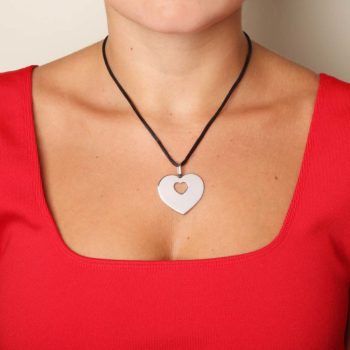 Poiray Coeur secret pendant worn on mannequin